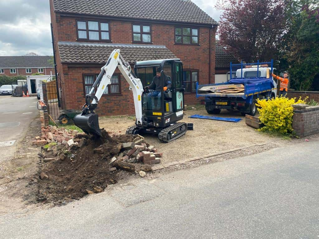 This is a photo of an operative of Sawston Driveways Digging out for a new tarmac driveway