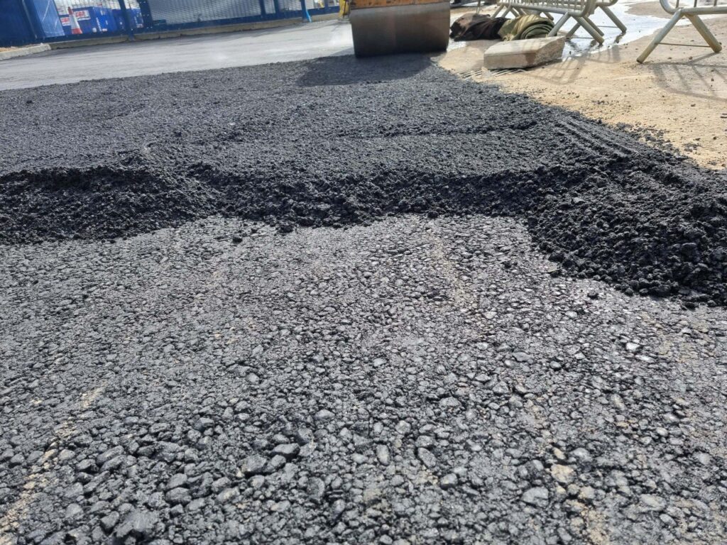 This is tarmac being laid by Sawston Driveways